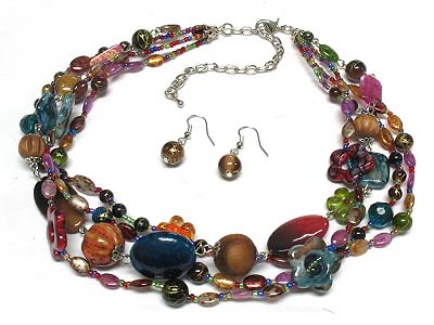 Multi floral glass and wood beads and looking patina link seed bead necklace and earring set 