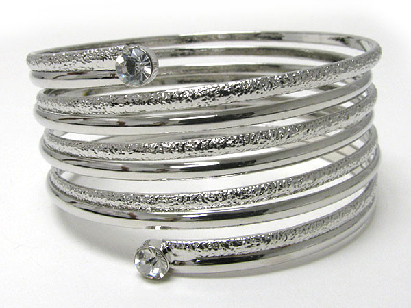 Crystal edge metal coil bangle