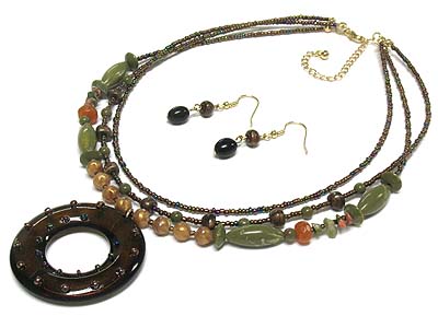 Round pendant and multi strand necklace and earring set