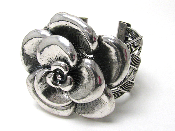 Large metal flower and woven metal stretch bracelet