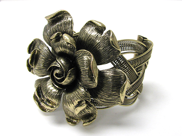 Large metal flower and woven metal stretch bracelet