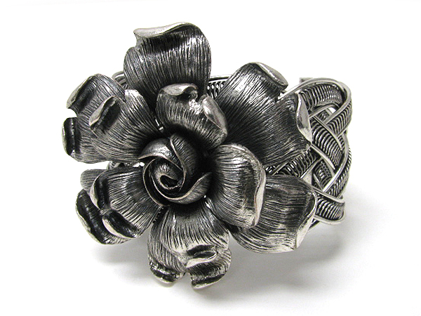 Large metal flower and woven metal stretch bracelet