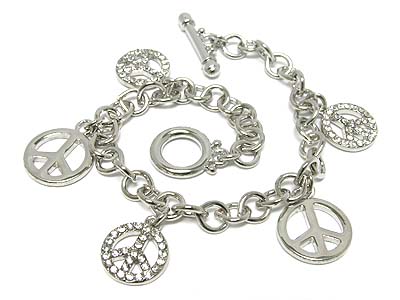 Multi crystal peace charm toggle bracelet