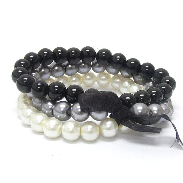 Bow tied three row pearl beads stretch bracelet