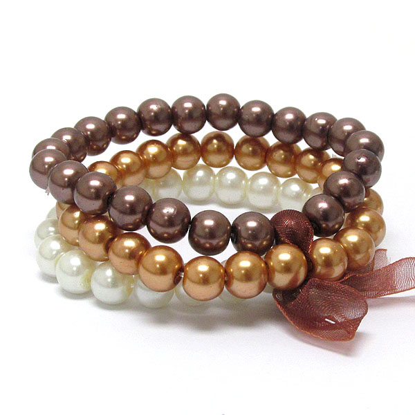 Bow tied three row pearl beads stretch bracelet