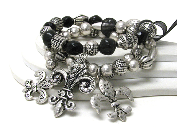 Multi metal ball and tirple fluer de lis charm stretch bracelet