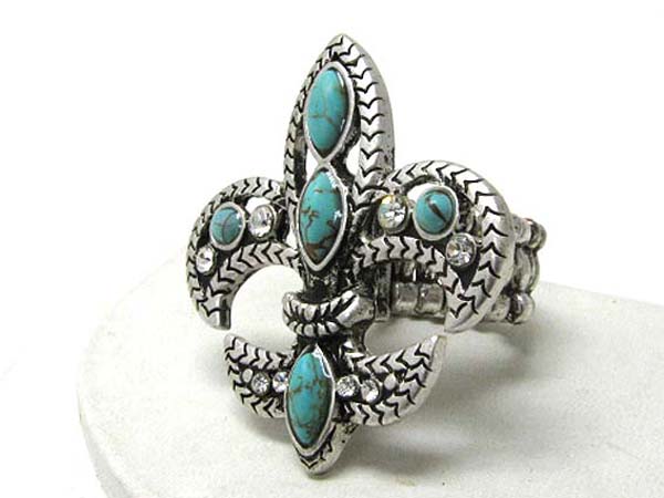 Large turquoise stone deco fleur de lis stretch ring