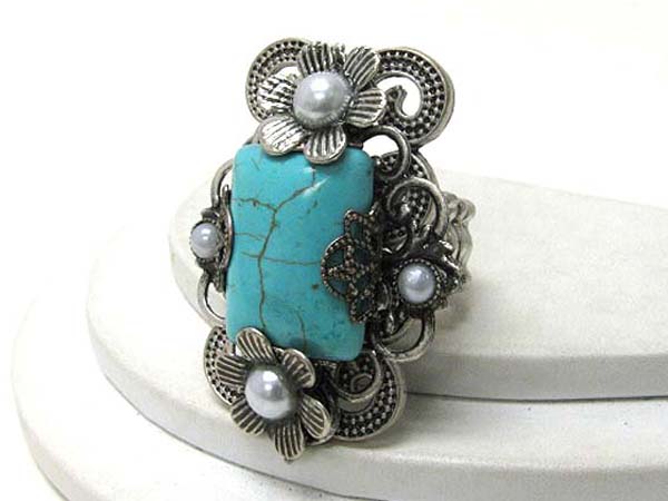 Large turquoise stone and metal flower art deco stretch ring