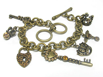 Crystal and burnish metal crown and key charm toggle bracelet