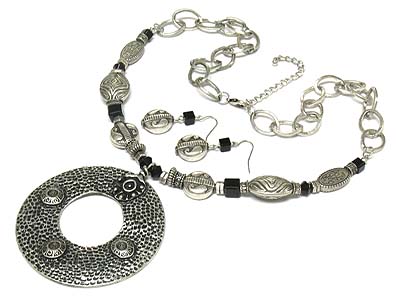 Metal stud large donut pendant and disk link necklace and earring set