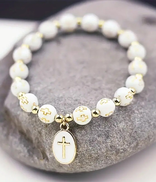 Cross charm and ball bead stretch bracelet