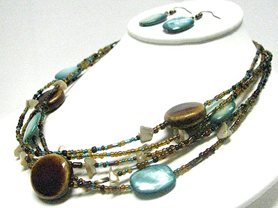 Ceramic and shell disk multi strand necklace earring set