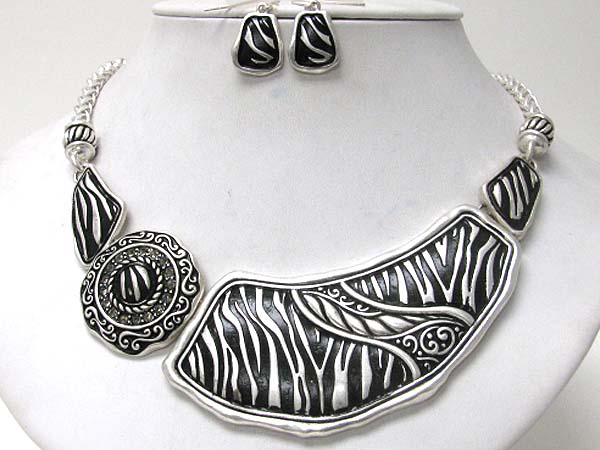 Metal filigree and animal print necklace earring set