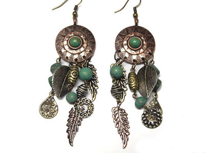 Antique style metal and patina ball earring