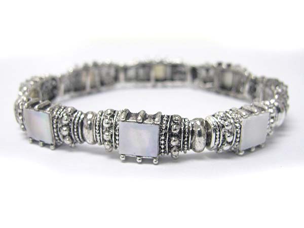 Glass stone and metal casting stretch bracelet