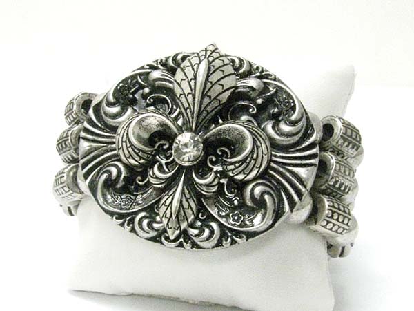 Crystal stud textured metal fleur de lis oval top metal ball stretch bracelet