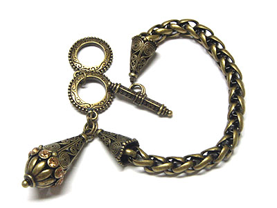 Burnish multi chain and antique charm toggle bracelet