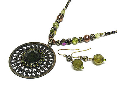 Metal filigree round pendant and beads sting necklace and earring set