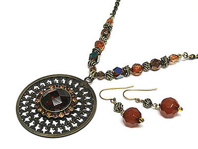 Metal filigree round pendant and beads sting necklace and earring set