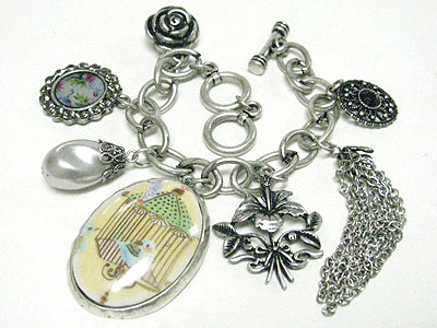 Antique style multi charm toggle bracelet