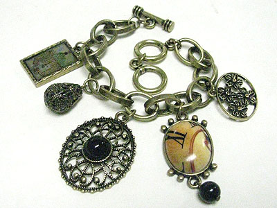 Antique style multi charm toggle bracelet