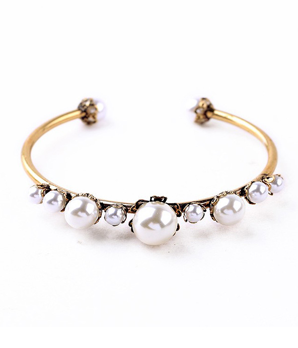 Boutique style multi pearl wire bangle bracelet