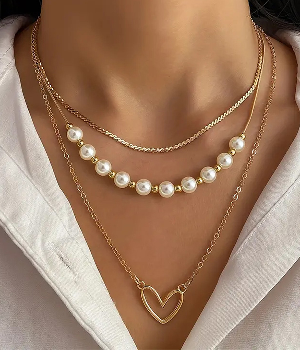 Triple layer heart pendant and pearl chain necklace