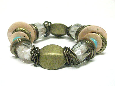 Antique style sea shell and metal beads stretch bracelet