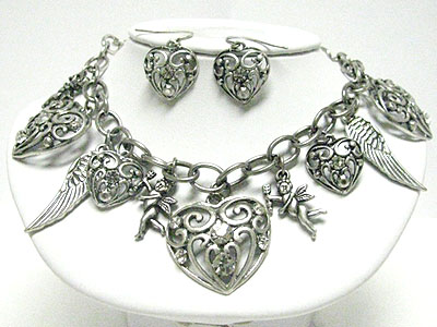 Crystal stud filigree metal heart and wing necklace set