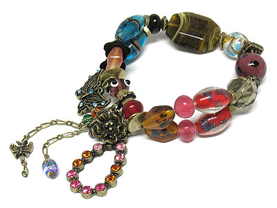 Genuine glass art beads and crystalbutterfly and flower charm stretch bracelet