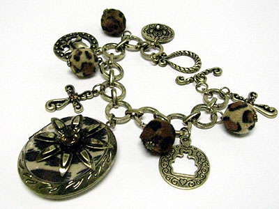 Leopard pattern and antique looking locket and charm dangle bracelet