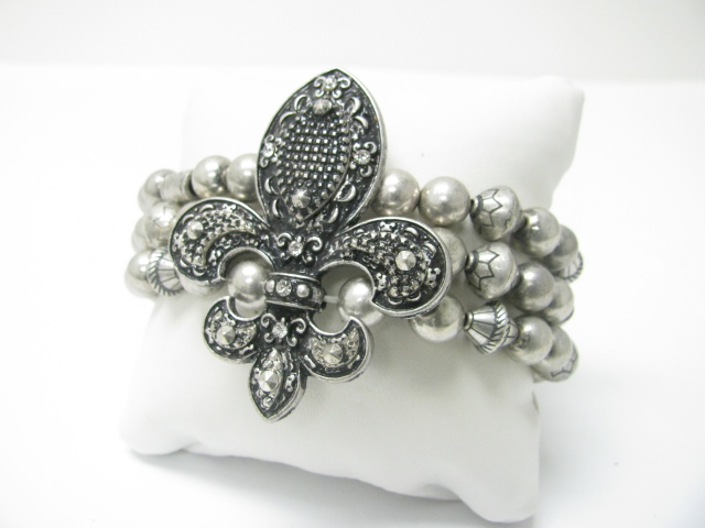 Crystal stud fleur de lis top multi row textured beads stretch bracelet