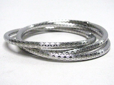 Triple texture surface metal bangle