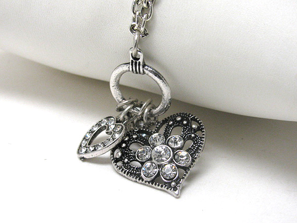 Crystal deco and metal filigree double heart necklace