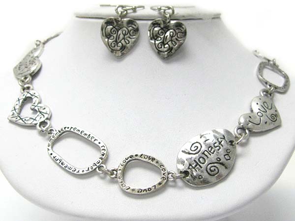 Tri-tone metal love theme necklace and earring set