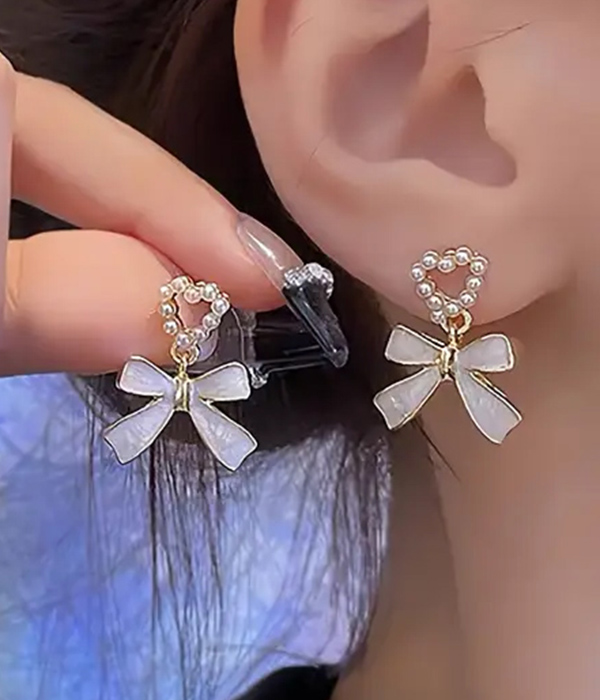 Pearl heart and bow drop earring