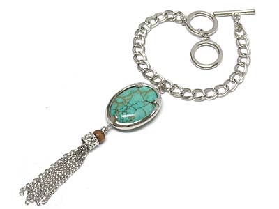 Turquoise oval charm with multi dangles toggle bracelet