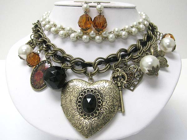 Metal filigree heart locket and mixed antique metal charm dangle pearl and multi chain necklace earring set