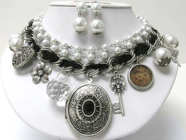 Metal filigree oval locket and mixed antique metal charm dangle pearl and multi chain necklace earring set