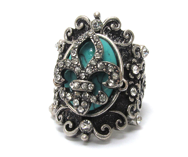 Retro vintage crystal fleur de lis on oval turquoise stone stretch ring