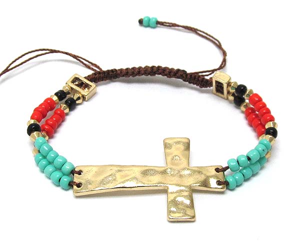 Hammered metal cross and two line seed beads braided cord bracelet