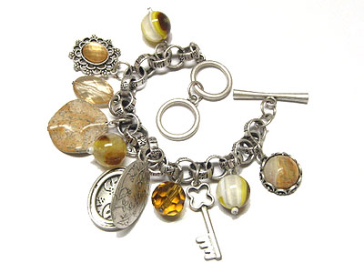 Multi stone and locket and key charm toggle bracelet