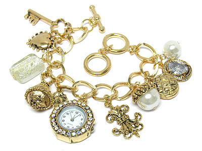 Crystal face and multi charm toggle watch