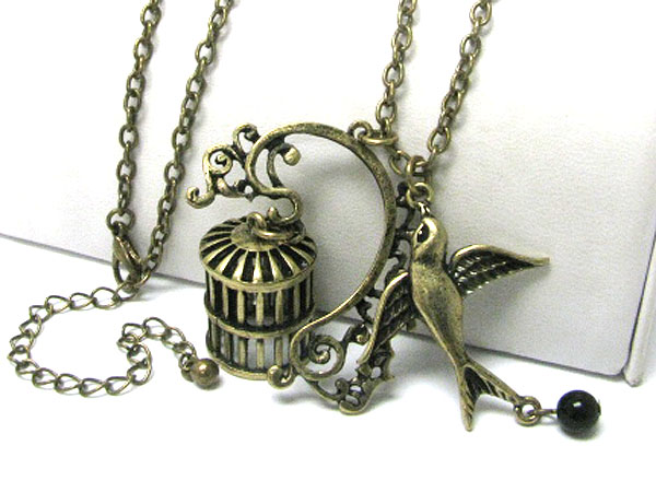 Burnish metal bird and bird cage charm dangle long necklace