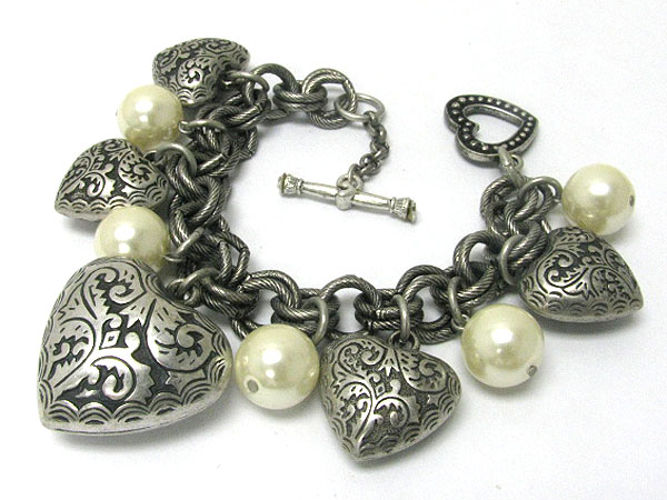 Textured metal heart charm and pearl ball dangle bracelet