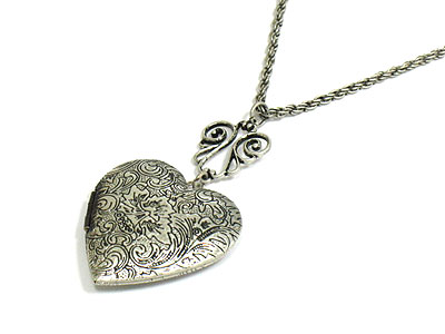 Filigree metal heart locket necklace