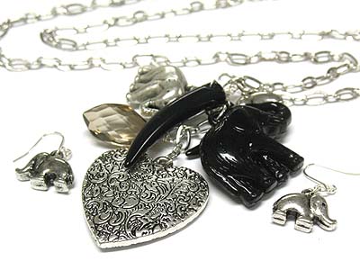 Filigree heart and tusk and elephant necklace and earring set