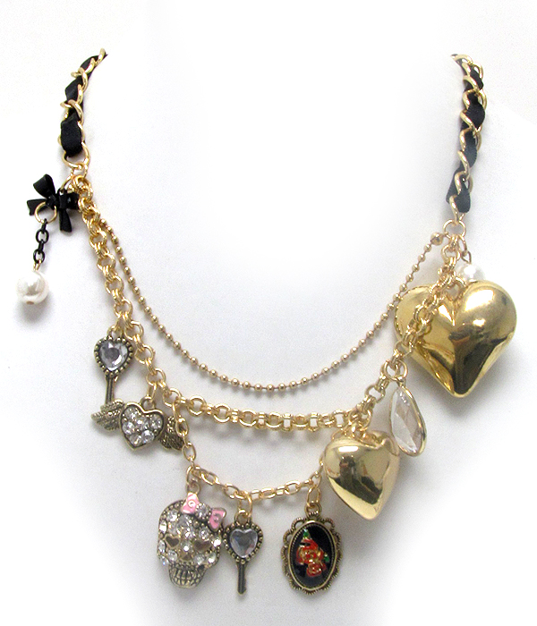 Designer style puff heart and crystal and epoxy skull charm with fabric chain necklace earring set