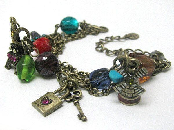 Antique style murano glass and eifel tower and windmill charm bracelet