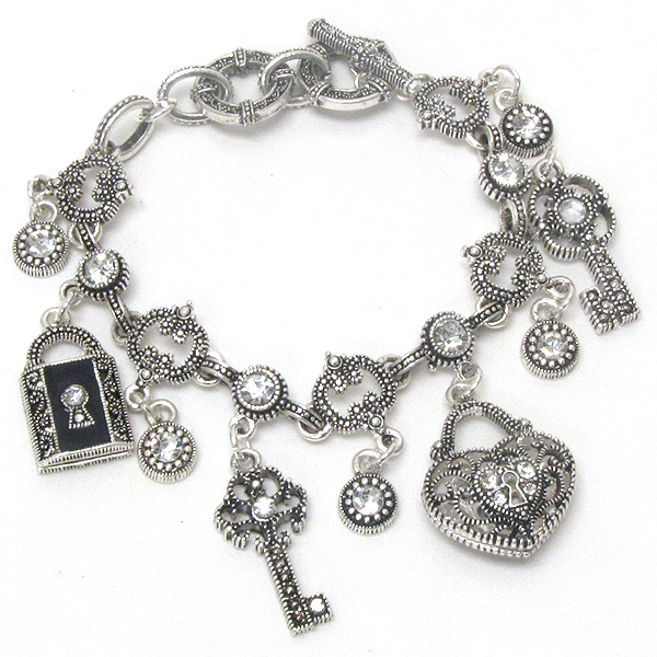 Crystal deco and metal filigree key and lock charm toggle bracelet